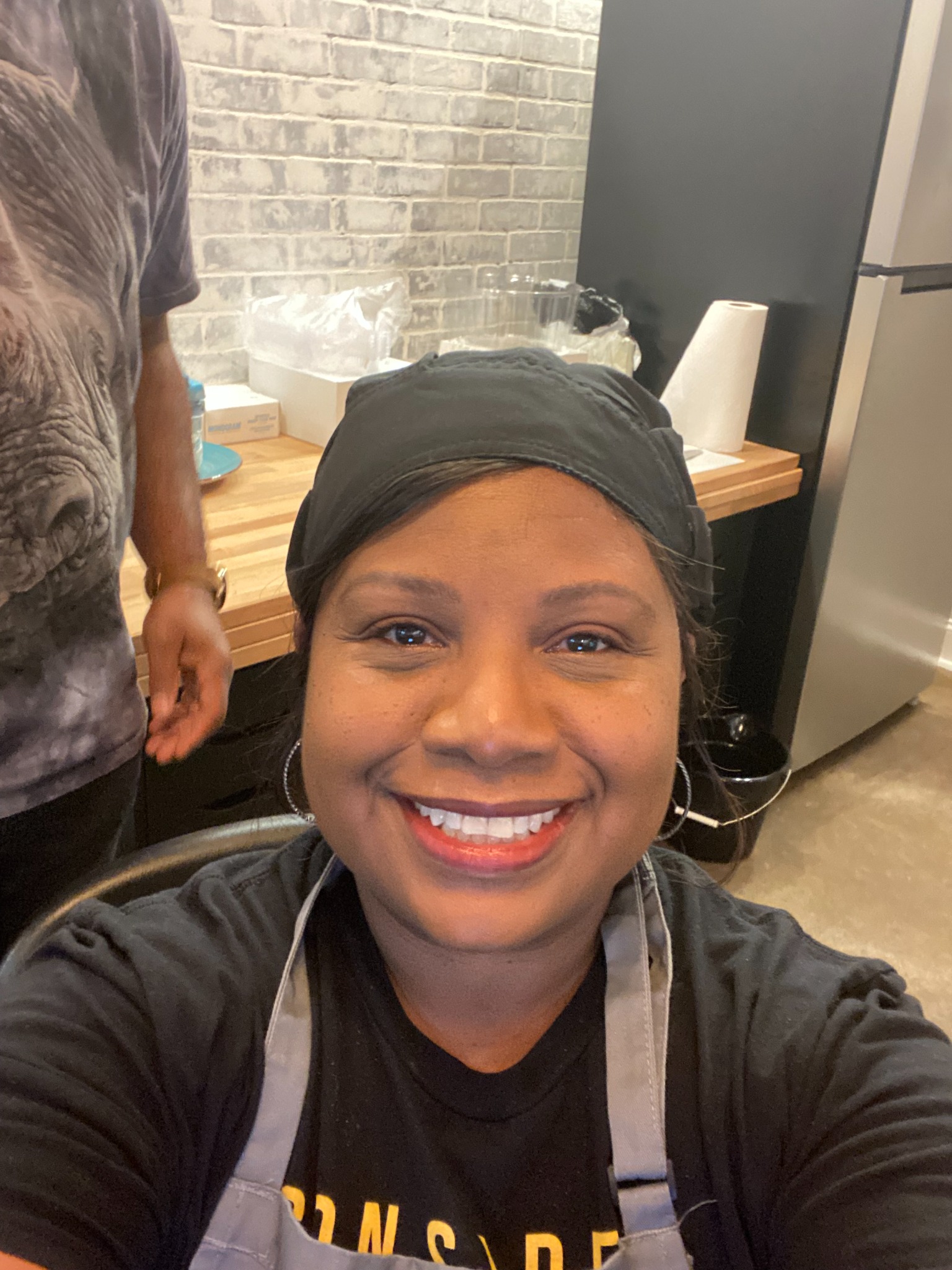 Mrs. Moore smiling inside Moore Pi Bakery Studio